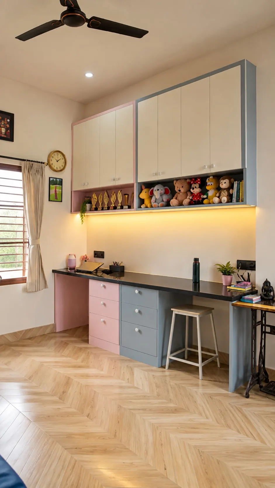 Study wall with a long desk, pink and grey drawers, upper cabinets and display shelves